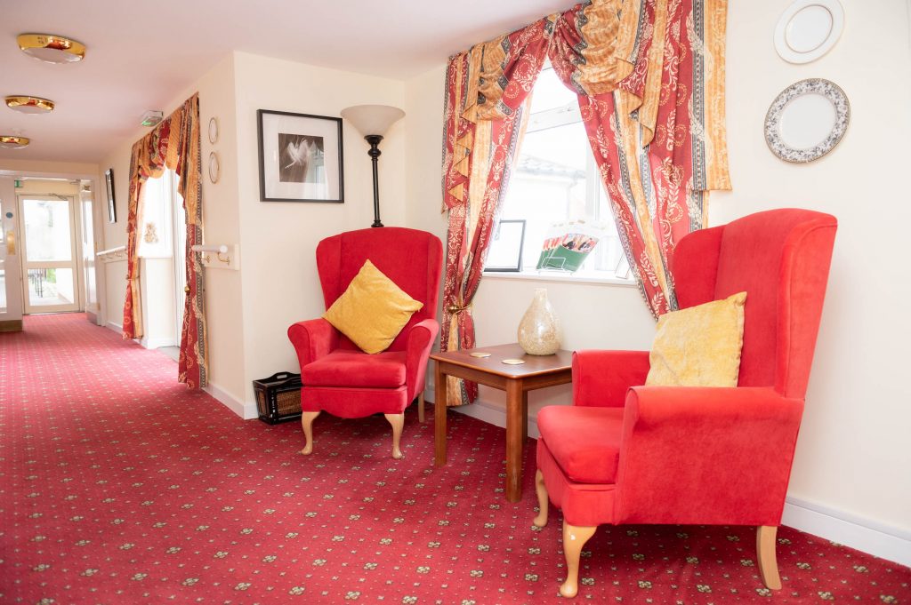 red chairs with yellow pillows in common area